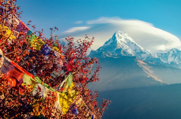 mountain covered with snow under cloudy sky